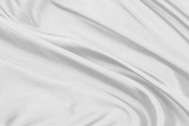 istock Smooth elegant white silk fabric or satin luxury cloth texture can use as wedding background. for drapery luxurious abstract design 1298238216
