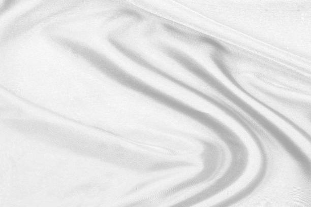 istock Smooth elegant white silk fabric or satin luxury cloth texture can use as wedding background. for drapery luxurious abstract design 1298238218