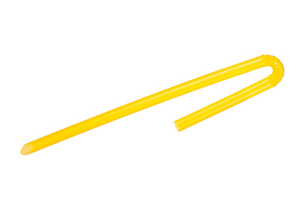 istock Yellow juice straw on white background 1298238233