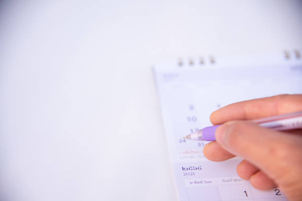 istock Blurred calendar in planning concept.Purple tone. 1298238315