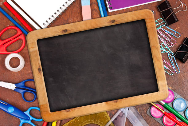 istock Chalk blackboard with school supplies 1298238725