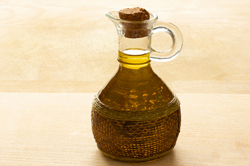 olive oil bottle on wooden table