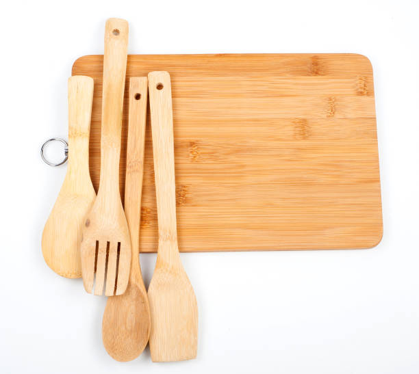 istock Wooden spoons and cutting board 1298239659