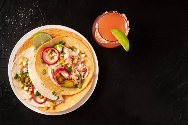 istock Tacos with chicken and avocado, with a Paloma cocktail 1298239735