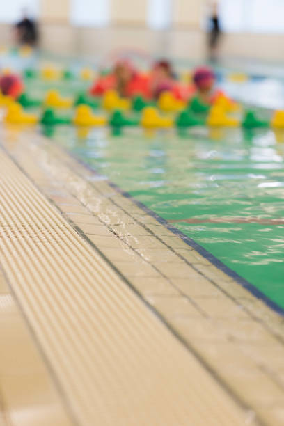 istock swimming in the indoor pool 1298240704