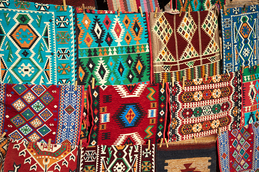 Colorful fabrics and carpets for sale at Petra Canyon in Wadi Musa, Jordan