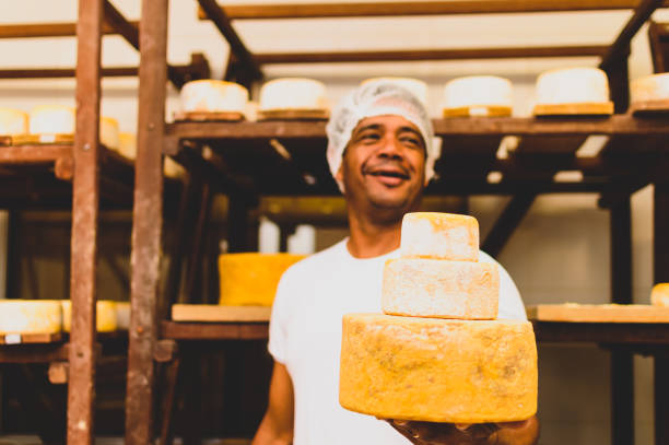 istock a man shows cheese in the ripening room 1298242790