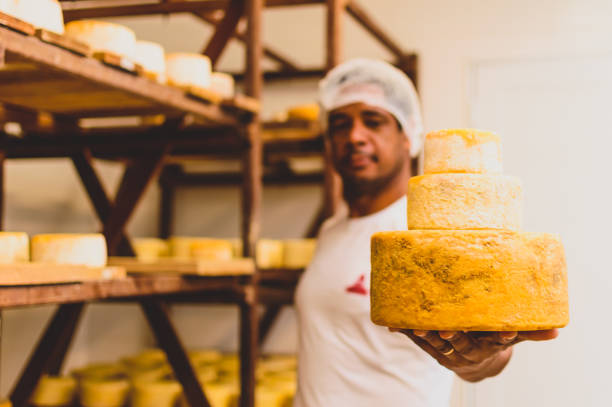 a man shows the artisan cheese production