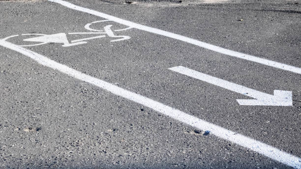 istock Bicycle road marking on the asphalt closeup 1298247467