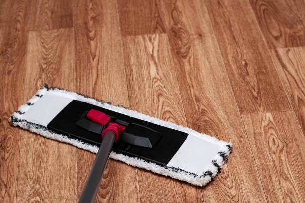 istock White mop washes wooden floor close up 1298247953