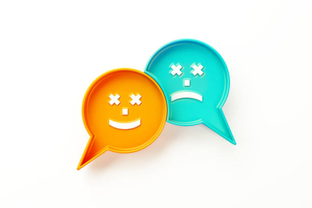 Orange and teal colored speech bubble pair with smiley and sad face symbols sitting over white background. Horizontal composition clipping path and copy space. Survey and rating concept.