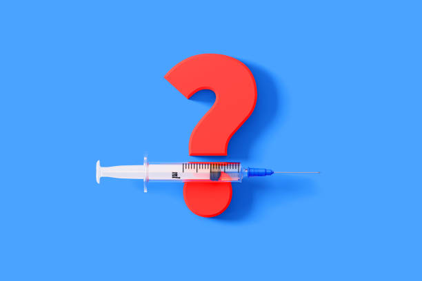 istock Syringe Sitting Over A Huge Red Question Mark Symbol On Blue Background 1298248861