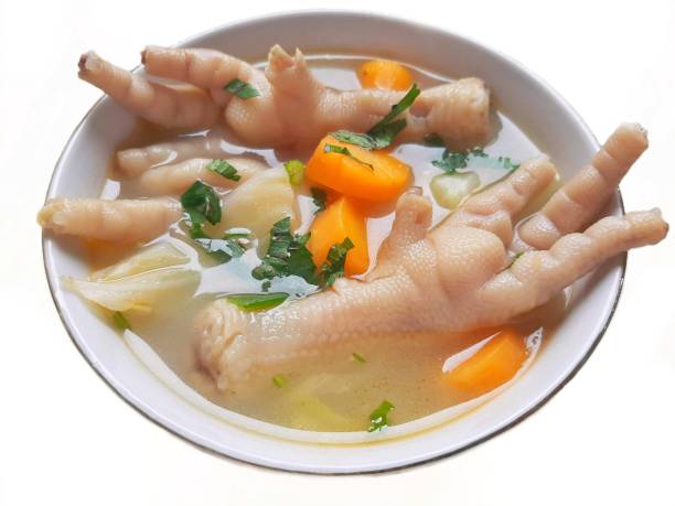 Chicken feet soup in a white bowl