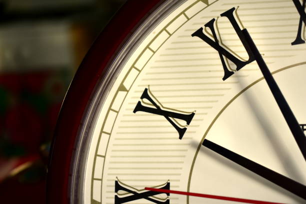 istock fragment of wall clock with roman numbers 1298250693