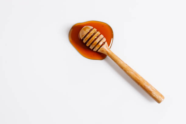 istock Fresh honey with bamboo dipper 1298251761