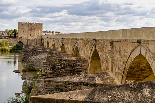 Roman bridge, across Guadalquivir river with Torre de Calahorra, Calahorra Tower in Cordoba, Andalusia, Spain