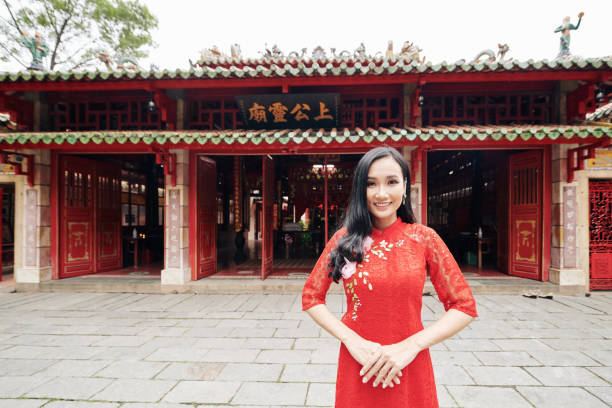 istock Woman standing at temple enterance 1298252789