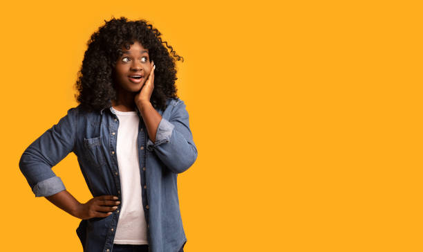 istock Shocked african american woman looking at empty space 1298253827