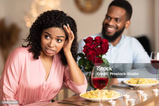 Black Woman On Unsuccessful First Date In Restaurant Stock Photo - Download Image Now