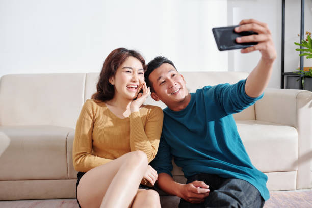 istock Couple in love taking selfie 1298254361