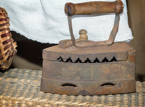 Vintage household utensils - cast iron iron that was heated glowing coals.