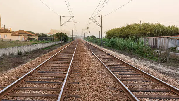 Photo of Ancient railway with double direction tracks in perspective