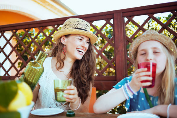 istock smiling trendy family sitting at table having brunch 1298255706