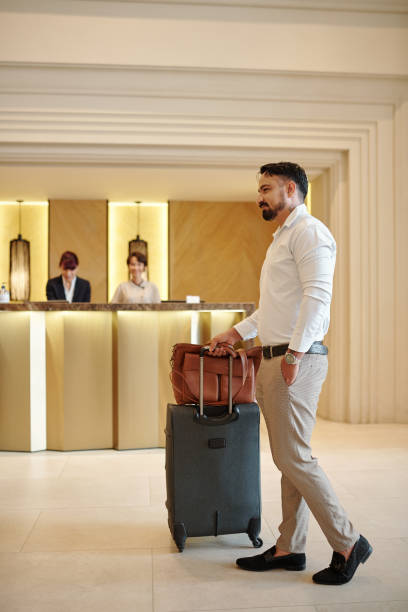 istock Elegant man in hotel lobby 1298257072