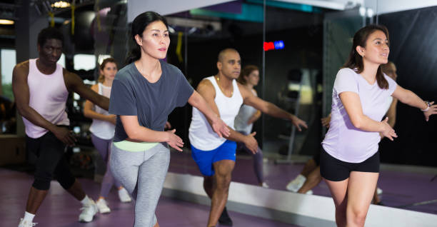 istock Young adult people training in dance studio 1298257265
