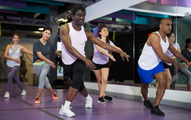istock Group of people practicing together in gym 1298257268