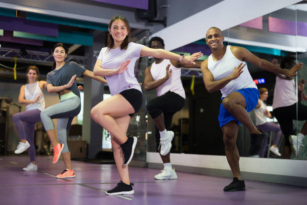 istock Group of people practicing together in gym 1298257283