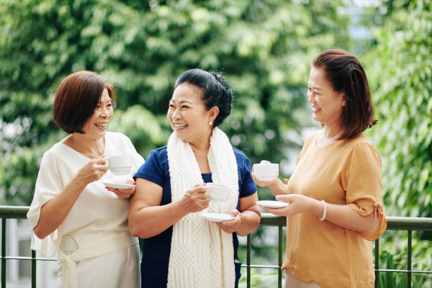 istock Senior female friends drinking tea 1298258397