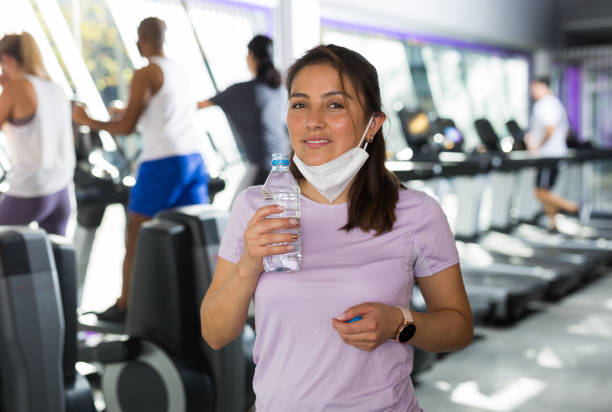istock Woman resting after workout with still water 1298258555