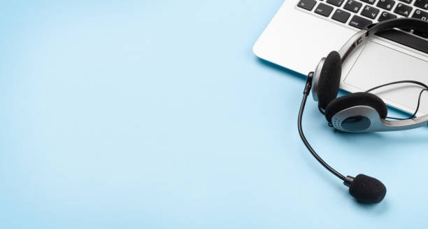 istock Office desk with headset and laptop. Work from home 1298259858