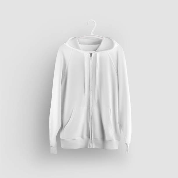 istock Mockup white hoodie with pocket, zipper closure, hanging on a plastic hanger, front view, isolated on background. 1298260027