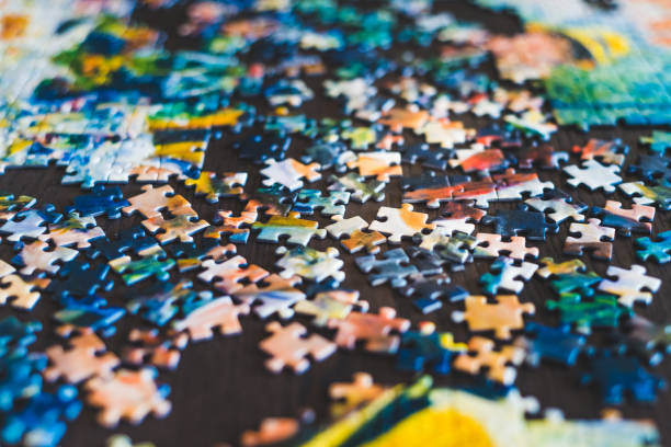 istock Pieces of puzzle on a table 1298261224