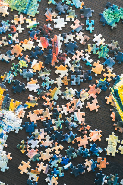 istock Pieces of puzzle on a table 1298261359