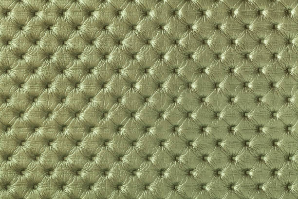 istock Texture of dark green and olive leather background with capitone pattern. 1298261542