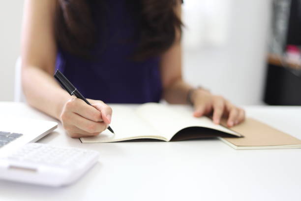 istock Online studying class for E learning. Smart student girl sitting at table watching lesson online and studying from home. Stay home stay safe 1298261634