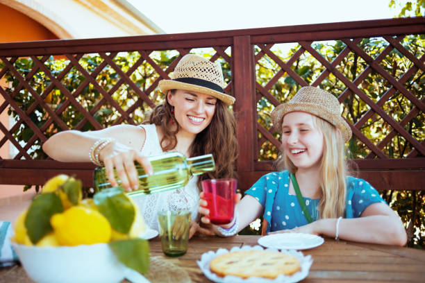 istock happy modern family sitting at table having breakfast 1298261835