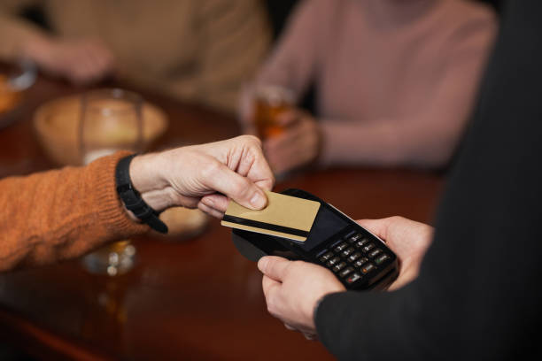 istock Unrecognizable Man Paying with Credit Card 1298262456