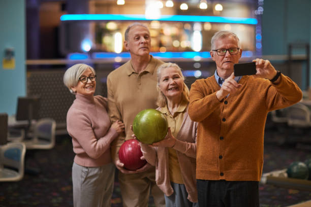 istock Senior People Taking Selfie Photos at Bowling 1298262458