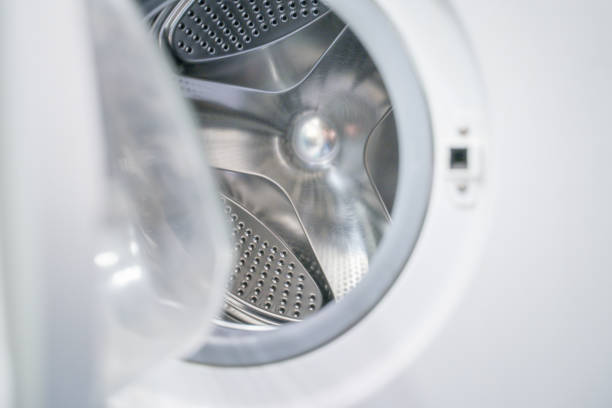 istock open door of an empty washing machine close up 1298262619