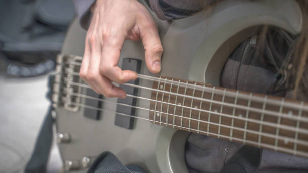 istock musician playing guitar, close up 1298262673