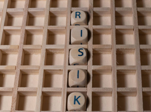 istock Wooden Letters with Word Risk 1298262923