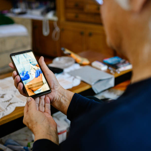 istock Senior woman looking application on smartphone 1298264638