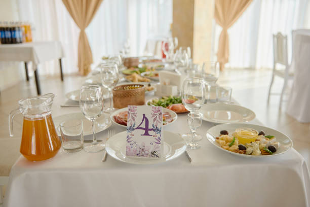 istock Table setting with wineglasses, plates and cutlery on table, copy space. Place setting at wedding reception. Table served for wedding banquet in restaurant 1298265872