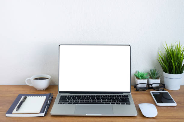 istock Wooden office desk table with keyboard of laptop, coffee cup and notebook, mouse computer with equipment office supplies. Business and finance concept. Workplace, Flat lay with blank copy space. 1298266204