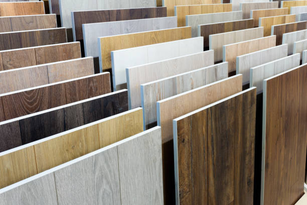 istock Laminate background. Samples of laminate or parquet with a pattern and wood texture for flooring and interior design. Production of wooden floors 1298269624