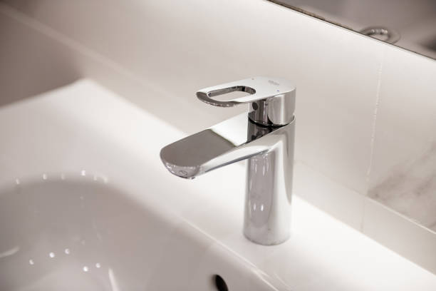 istock Metal chrome new rubbish on washbasin 1298270702